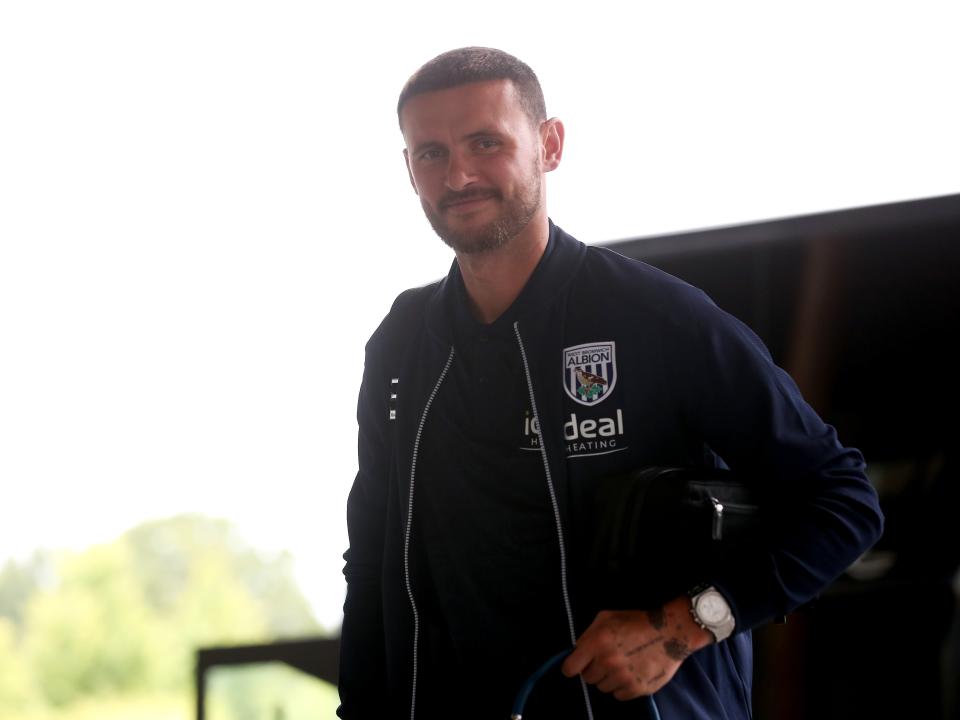 John Swift arriving at St. George's Park smiling at the camera 
