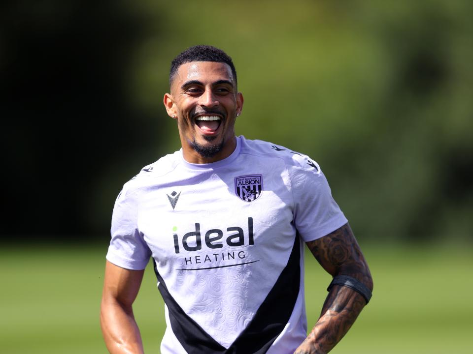 Karlan Grant laughing during a training session