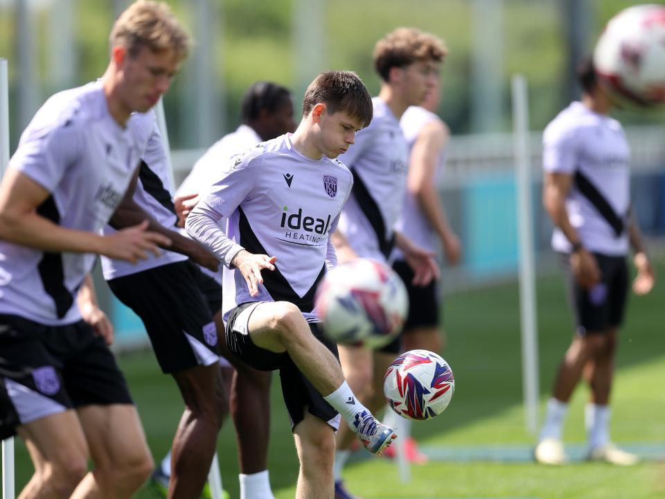 A general view of several players on the ball at St. George's Park