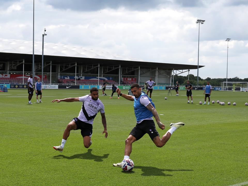 Karlan Grant up against Darnell Furlong during a training session at St. George's Park