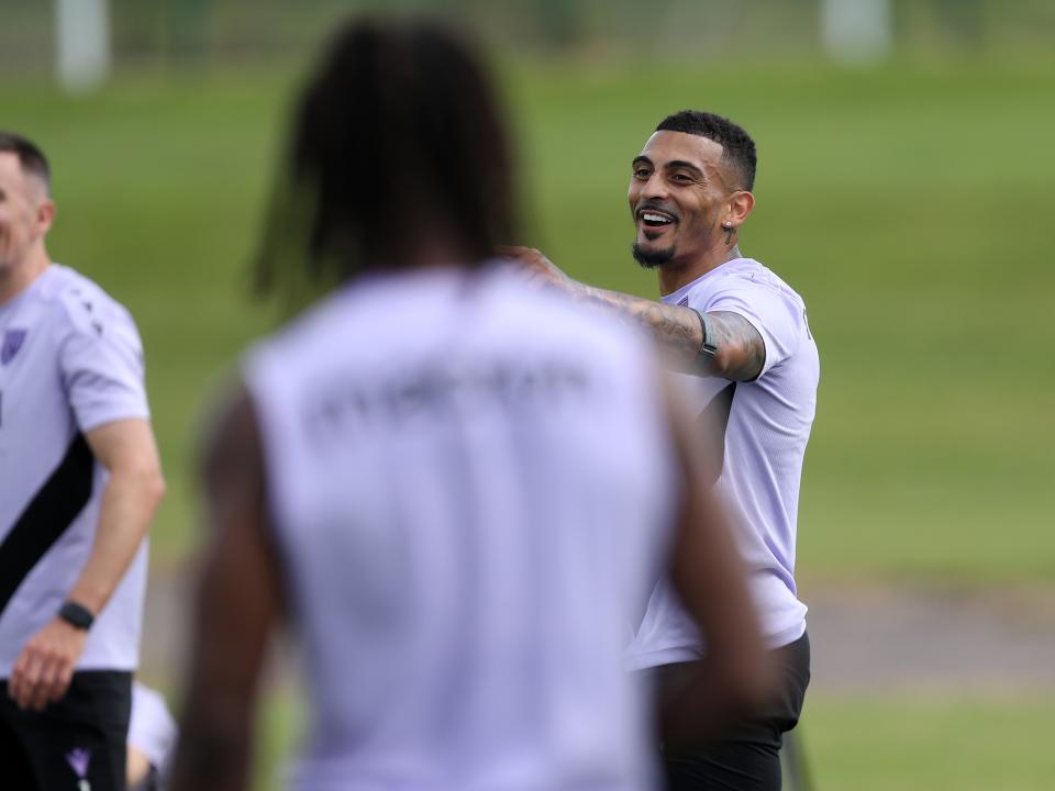 Karlan Grant laughing during a training session