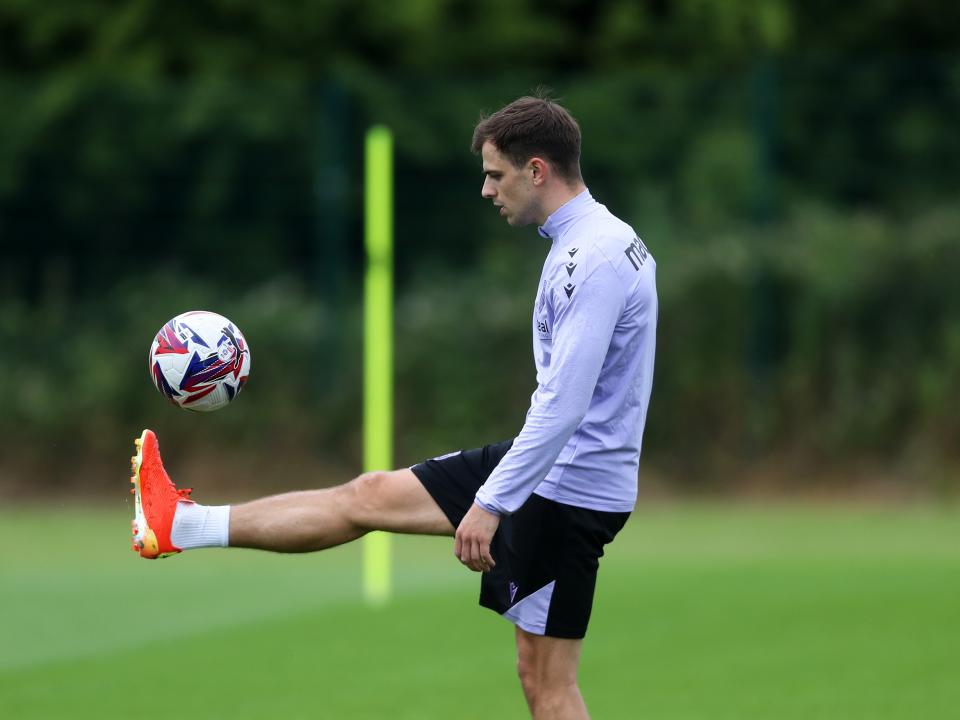 Jayson Molumby controlling a ball during a training session 