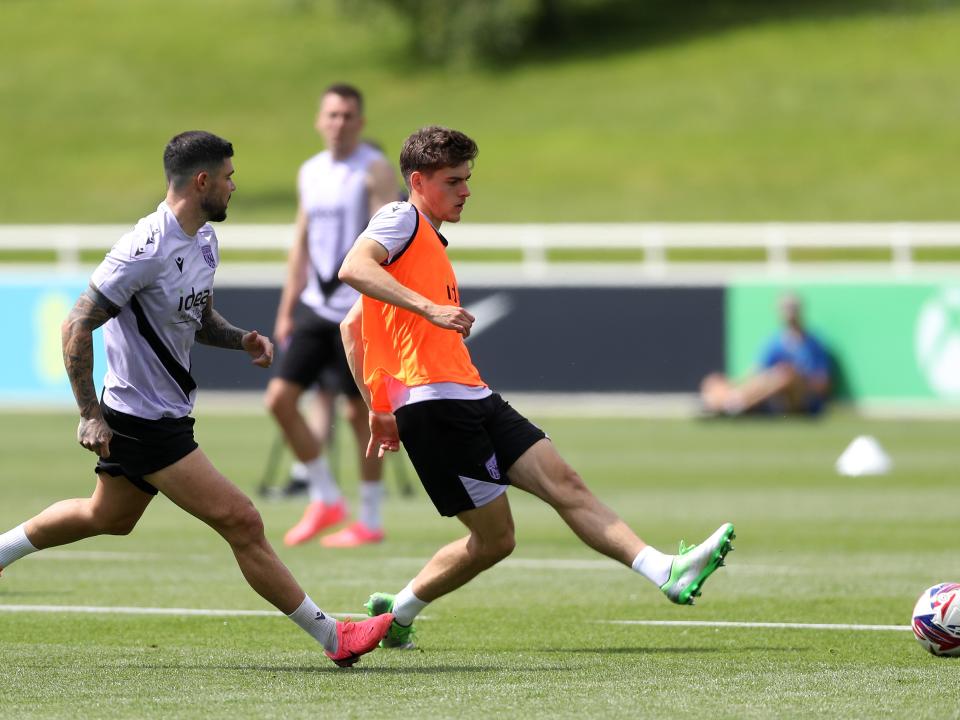 Tom Fellows passing the ball during a training session at St. George's Park