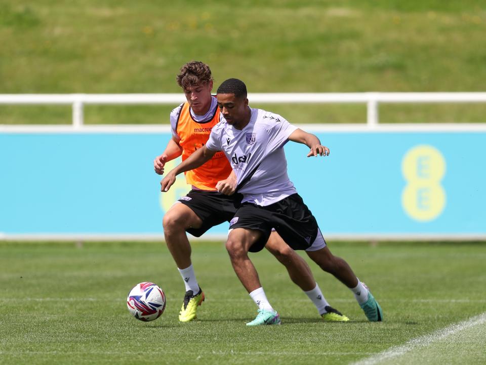 Cole Deeming and Deago Nelson battle for the ball during a training session at St. George's Park