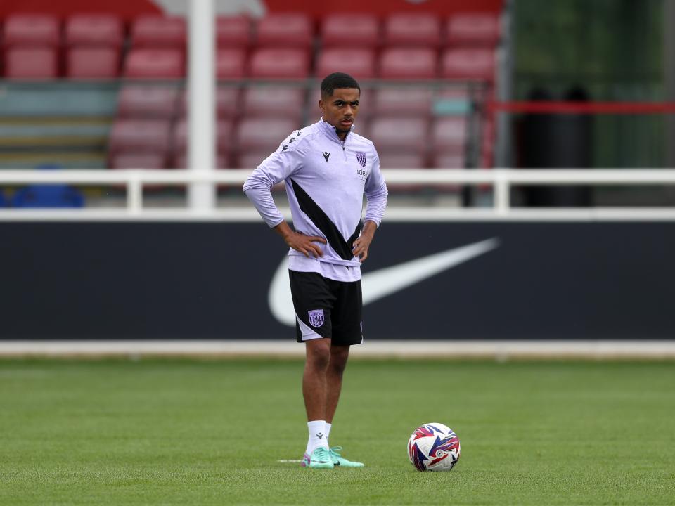 Deago Nelson stood by the ball on the training pitch at St. George's Park