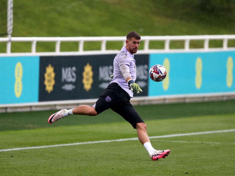 Alex Palmer kicking a ball during a training session at St. George's Park