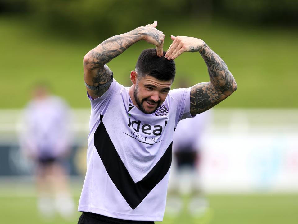 Alex Mowatt with his hands on his head during a training session at St. George's Park