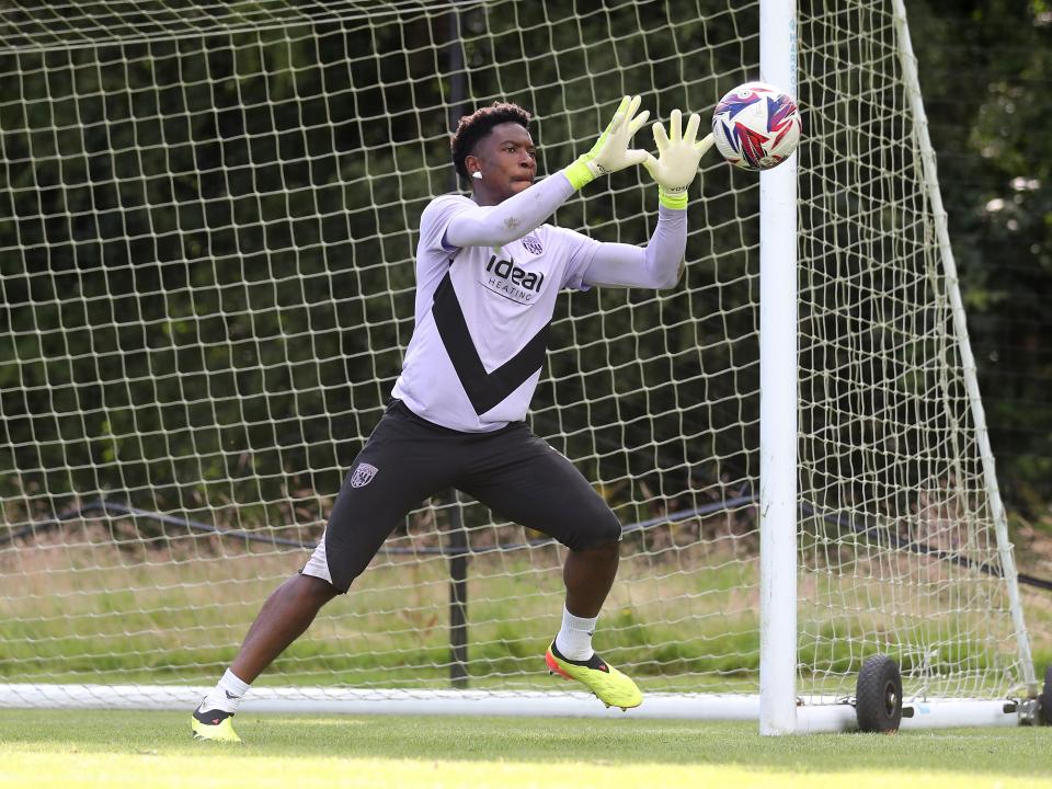 Ben Cisse catching the ball during a training session at St. George's Park