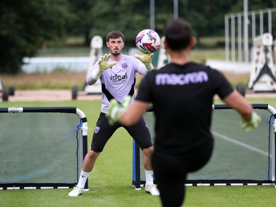 Joe Wildsmith catching the ball during a training session at St. George's Park