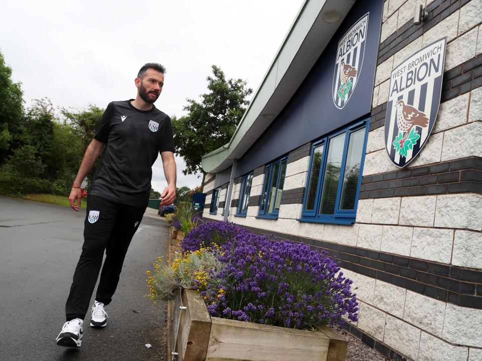 Carlos Corberán walking into the training ground