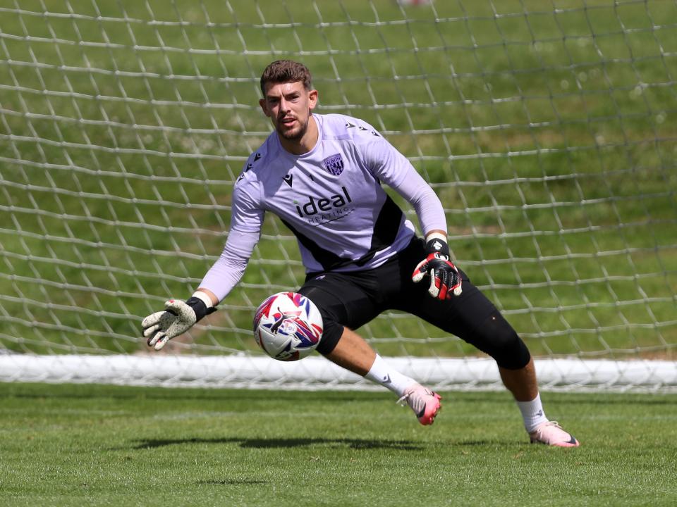 Alex Palmer diving for a ball in training 