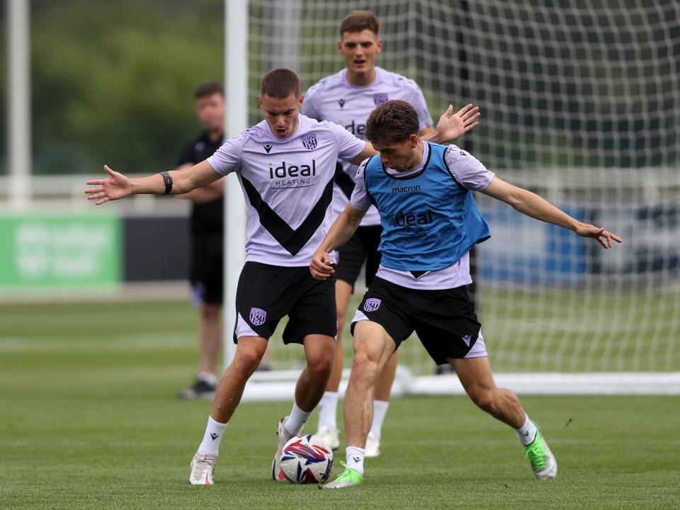 Conor Townsend and Tom Fellows battle for the ball during training at St. George's Park 