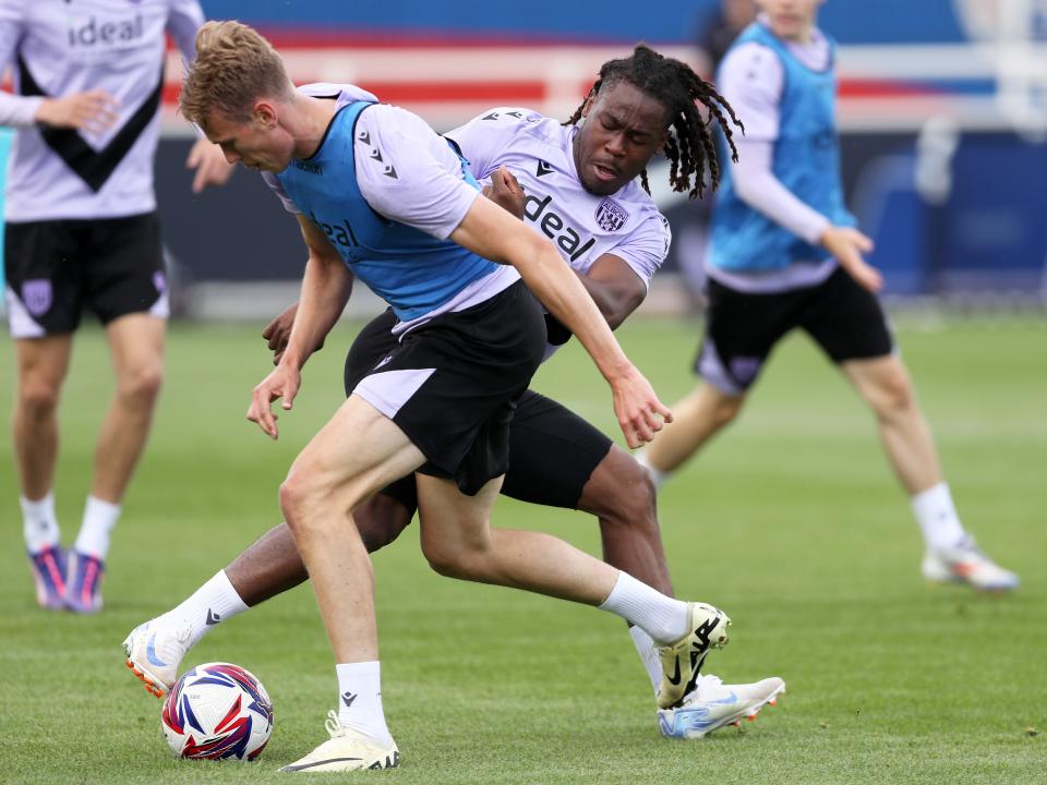 Brandon Thomas-Asante and Torbjørn Heggem battle for the ball during training at St. George's Park