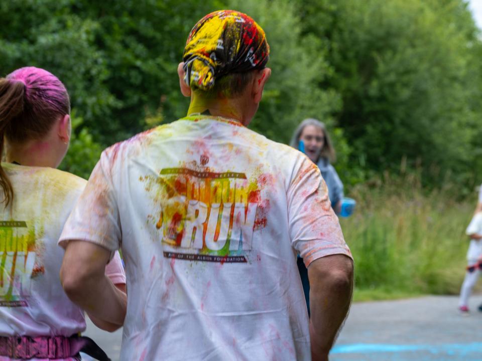 Back of runners, Dannie Heeley, and Blind Dave Heeley, heading towards a colour station.