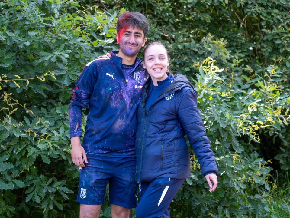 Two Foundation staff member posing for a photo at another colour station.