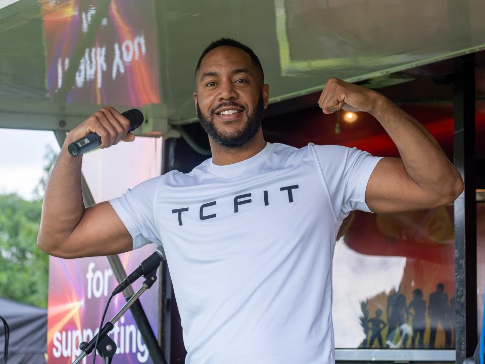 Tony Clark (TC Fit) flexing muscles.