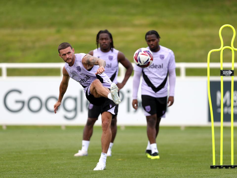 John Swift taking a shot during a training session at St. George's Park