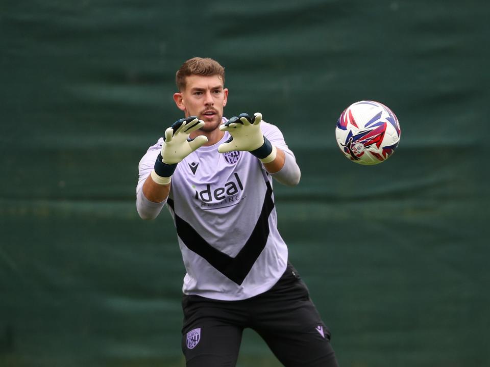 Alex Palmer preparing to catch a ball in training 