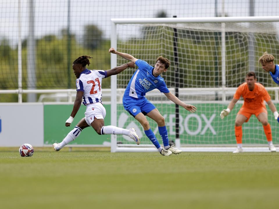 An image of Brandon Thomas-Asante shooting against Peterborough