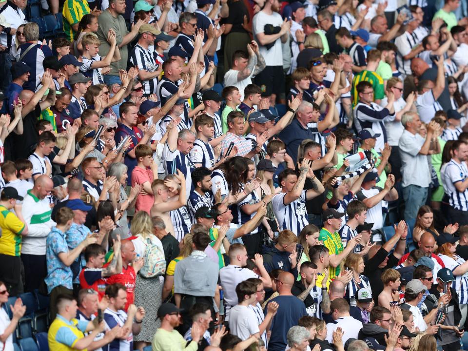 An image of West Bromwich Albion supporters applauding their team