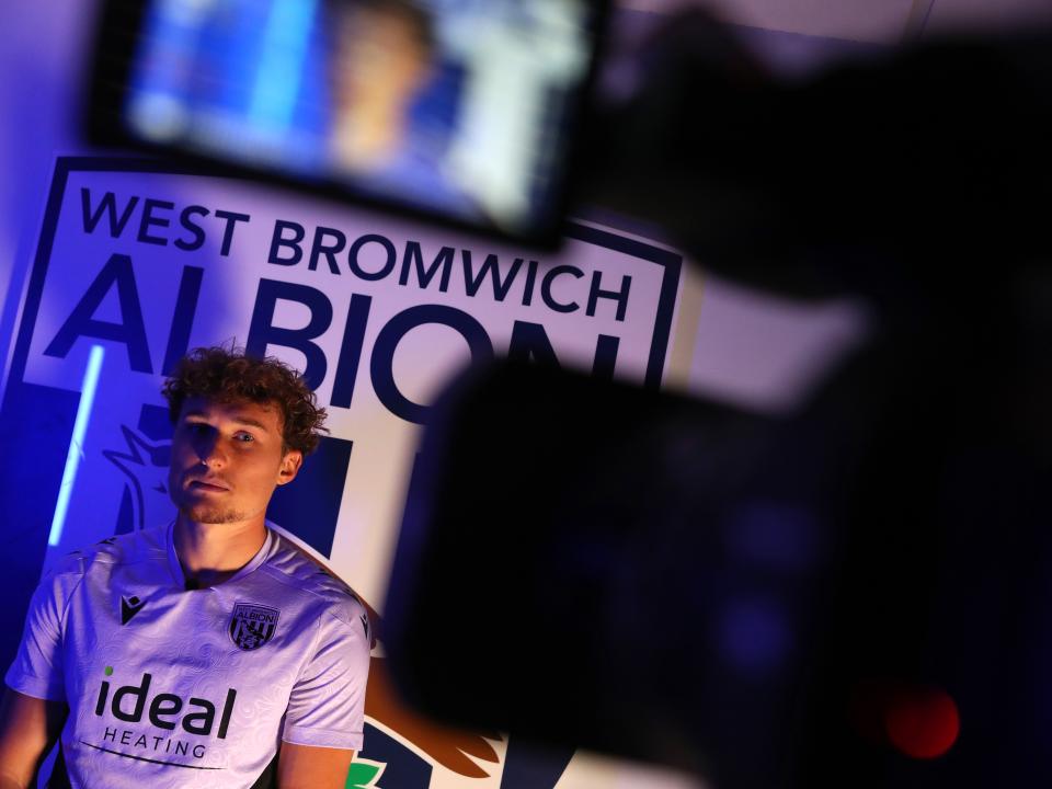 Callum Styles being interviewed in front of a WBA badge 