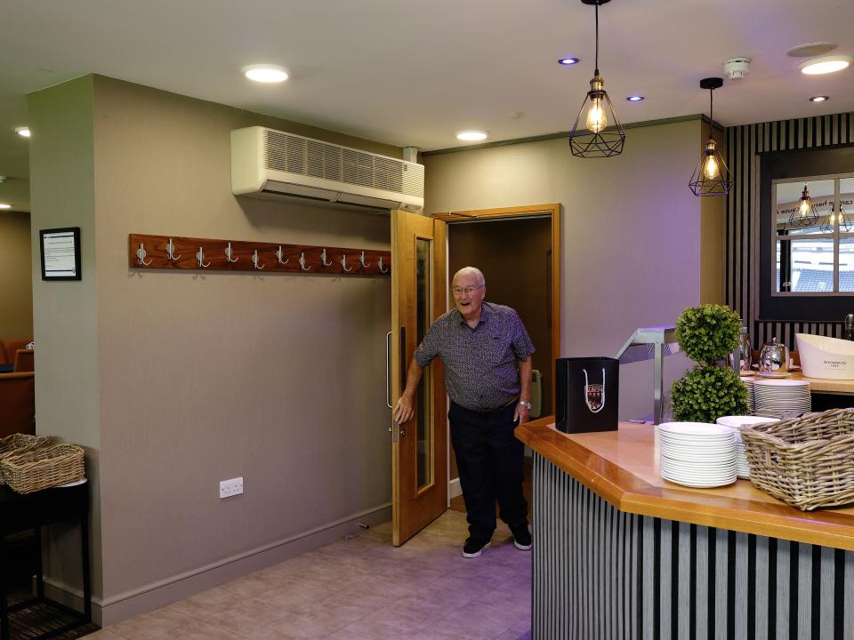 Graham Williams walks into the Graham Williams Suite at The Hawthorns
