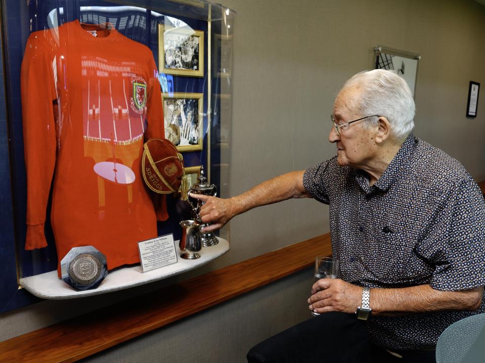 Graham Williams looking at a picture on the wall at The Hawthorns 