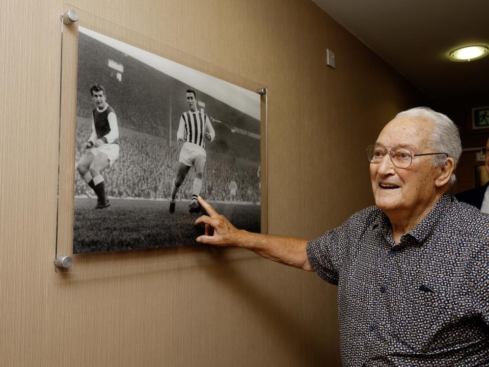 Graham Williams looking at a picture on the wall at The Hawthorns 