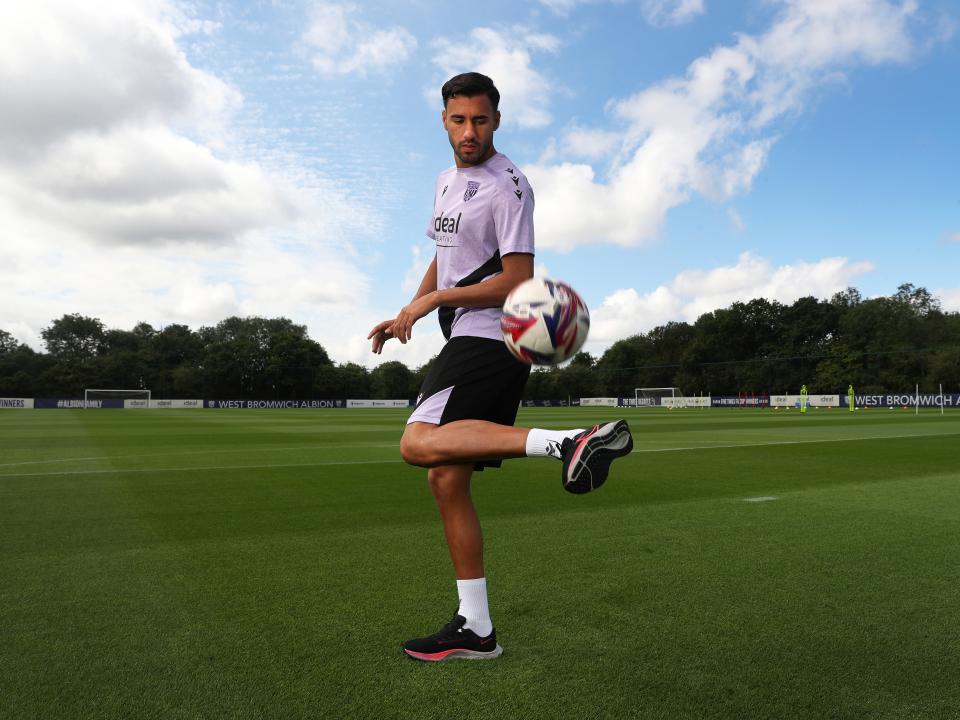 Gianluca Frabotta juggling a football on a training pitch 