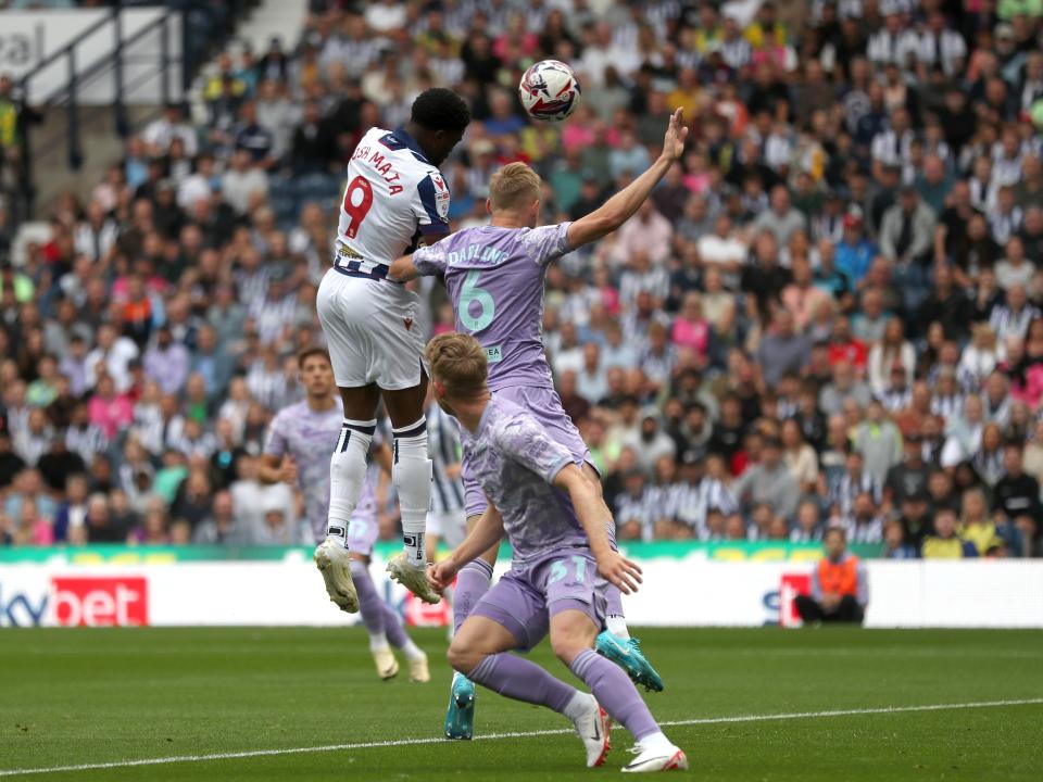 Josh Maja jumps to try and win a header against Swansea 