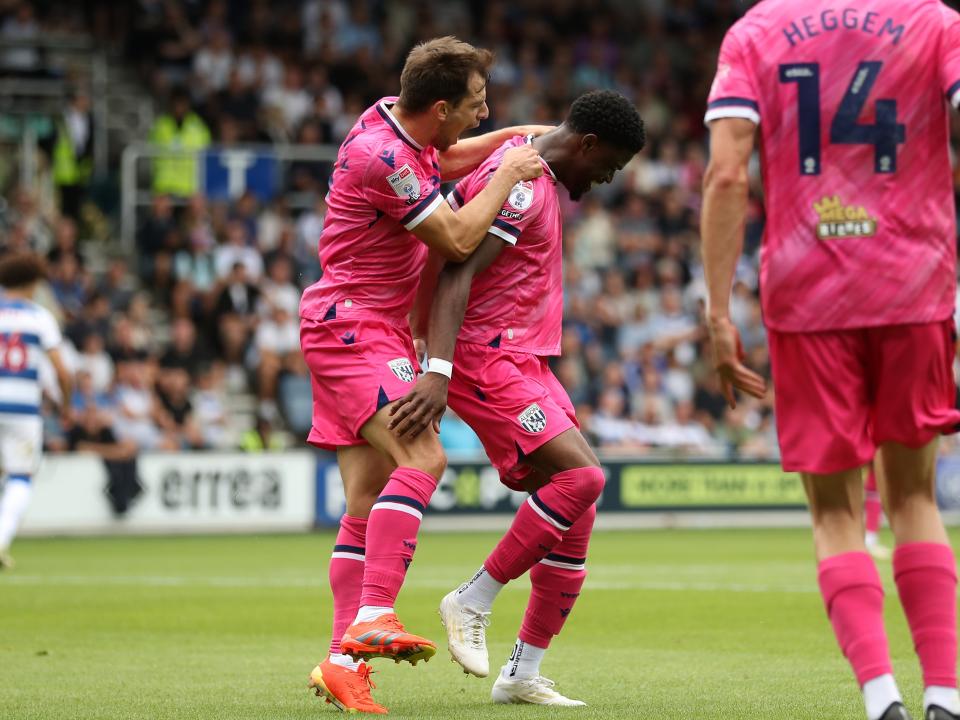 Josh Maja celebrates scoring his first goal at QPR with Jayson Molumby