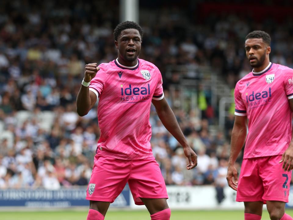 Josh Maja celebrates scoring his first goal at QPR with Darnell Furlong 
