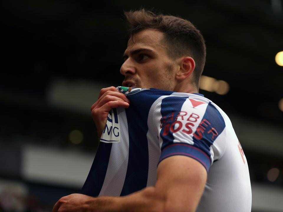 Jayson Molumby celebrates scoring against Swansea 