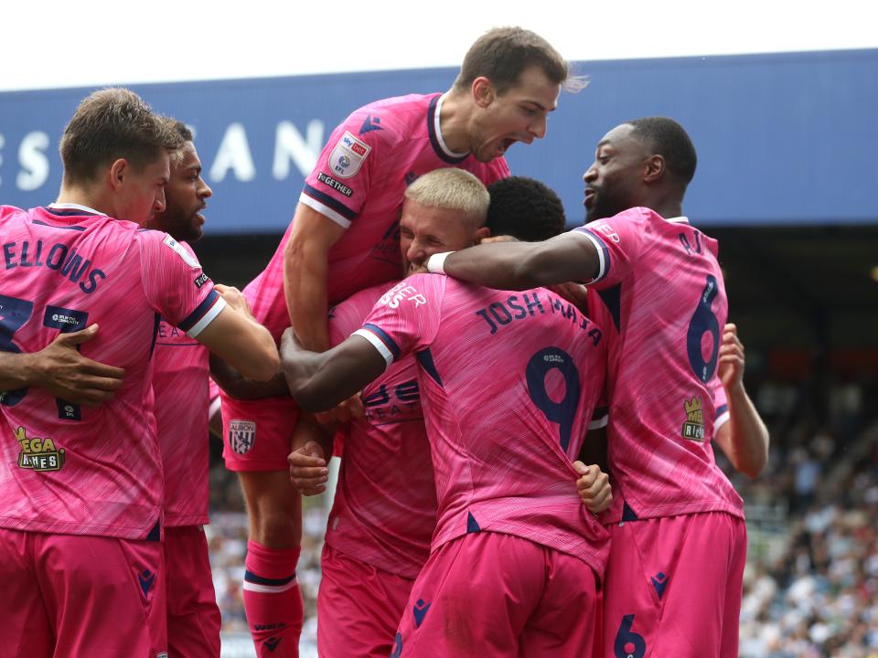 Josh Maja celebrates scoring his second goal at QPR with team-mates