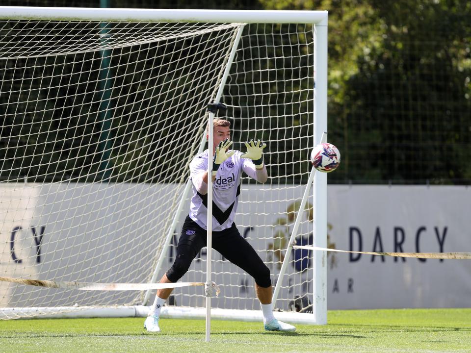 Alex Palmer catching a ball during a training session 