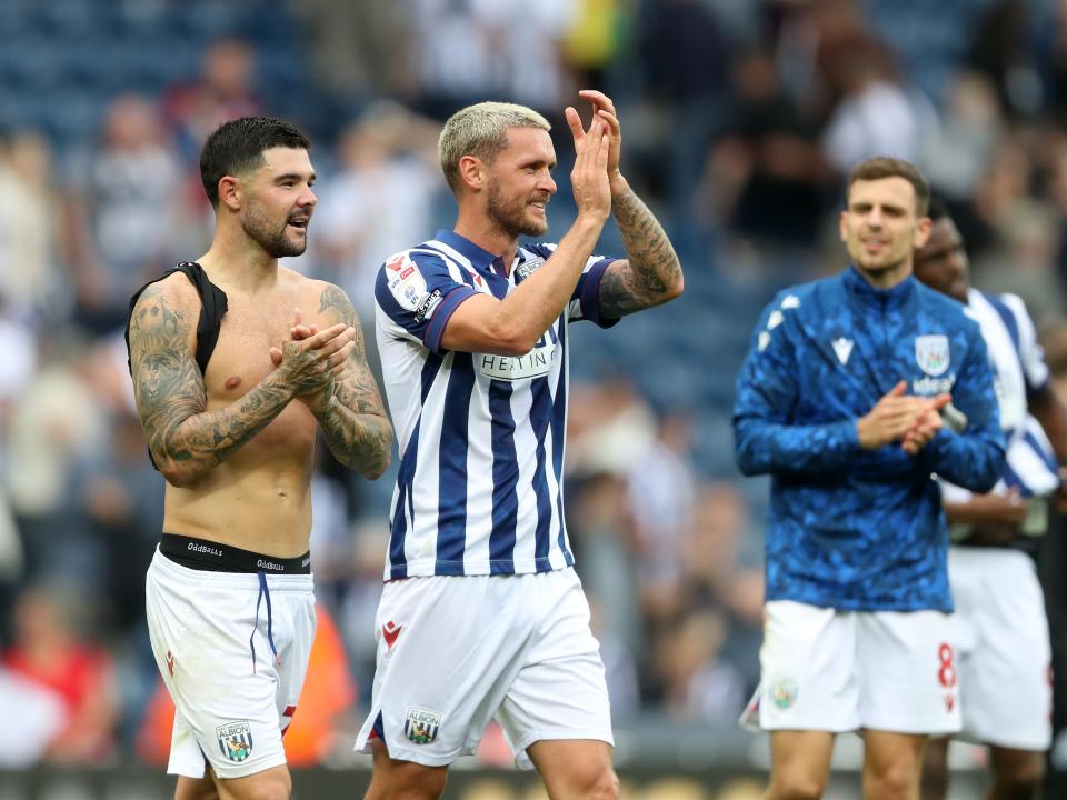 Alex Mowatt and John Swift applauding Albion fans after the game against Swansea 