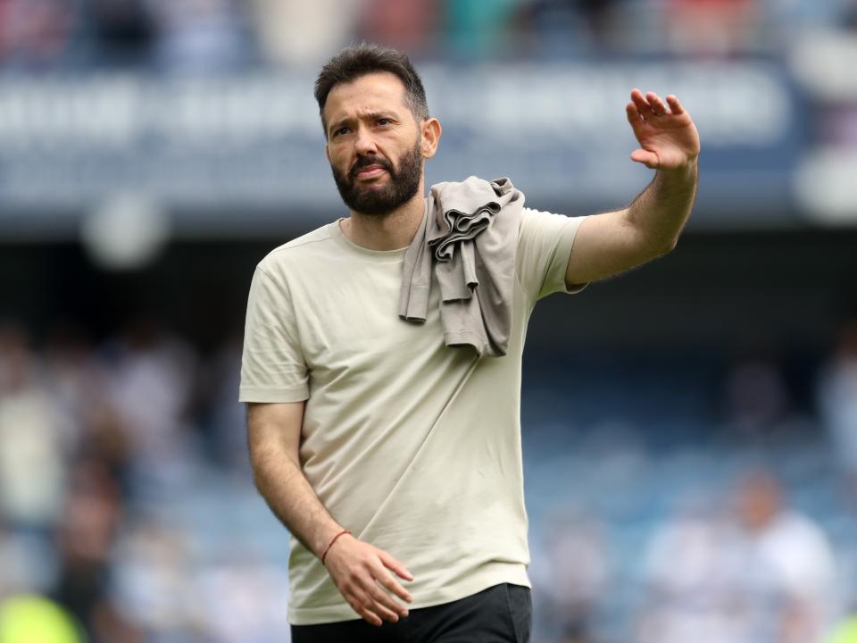 Carlos Corberán applauding Albion fans at QPR 
