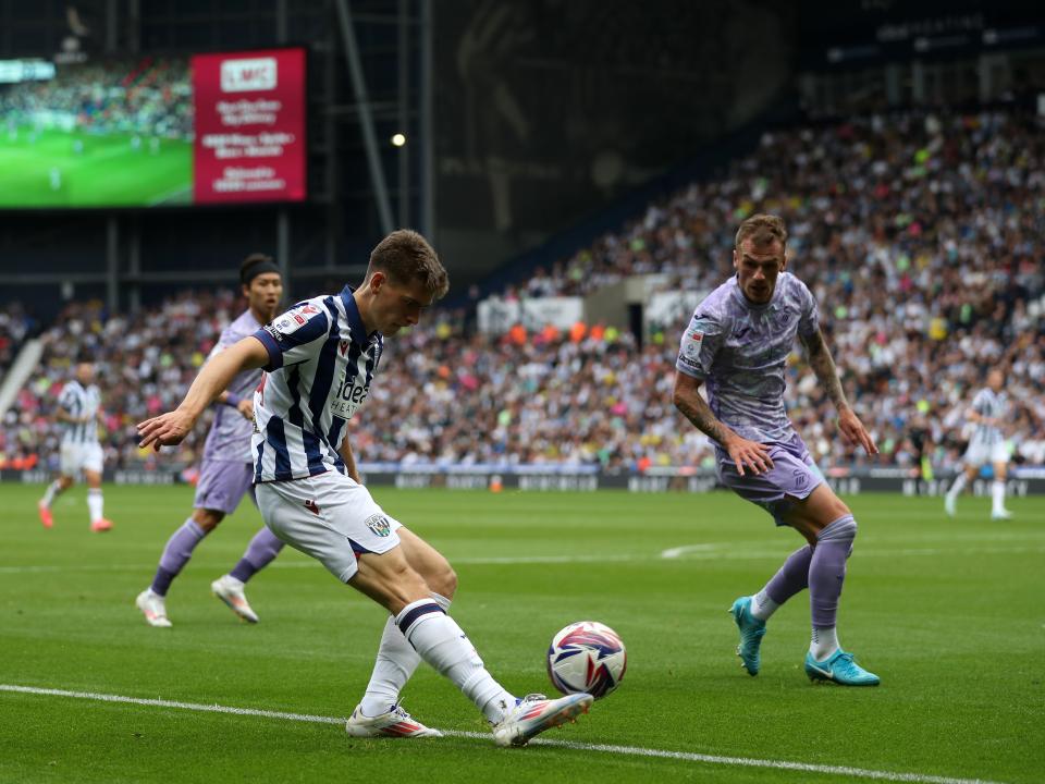 Tom Fellows crossing the ball against Swansea 