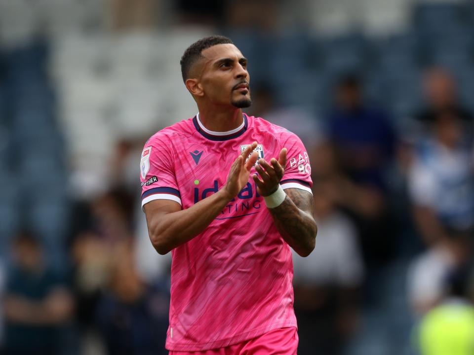 Karlan Grant applauding Albion fans at QPR 