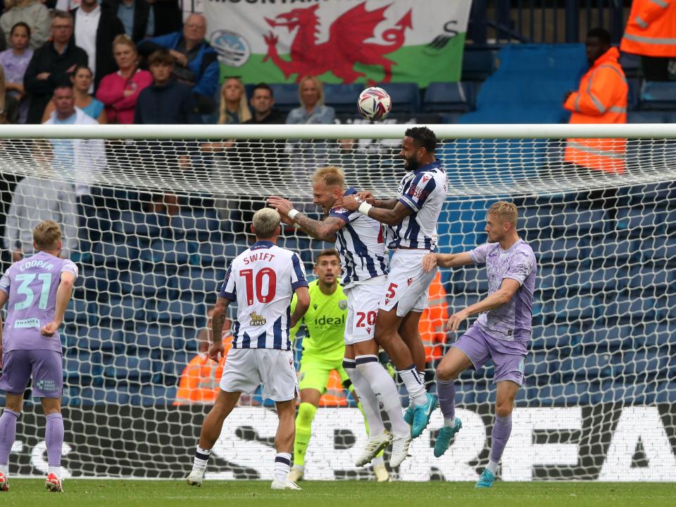 Kyle Bartley jumps to win a header against Swansea 
