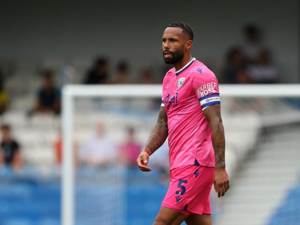Kyle Bartley watching the game at QPR with the captain's armband on