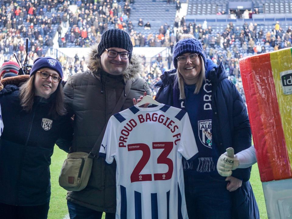 Jack Heeley holds the Proud Baggies 23 shirt.