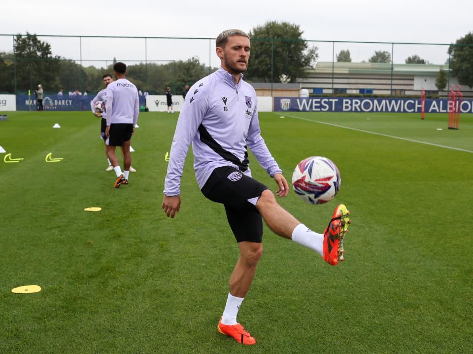 John Swift juggling a ball during a training session 