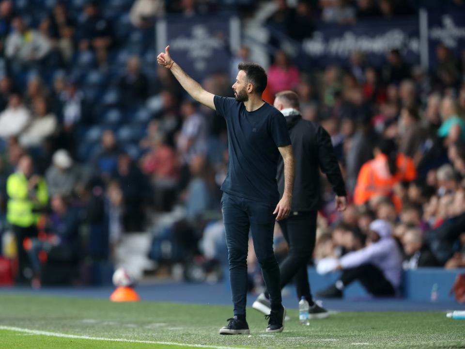 Carlos Corberán with his thumb up on the side of the pitch against Plymouth 