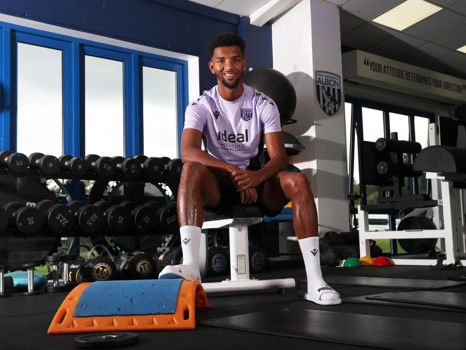 Mason Holgate smiling at the camera while sat in the gym