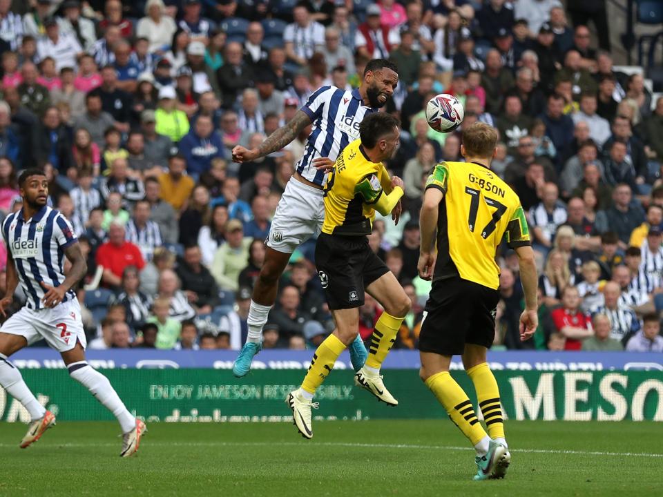 Kyle Bartley jumping to try and win the ball against Plymouth 