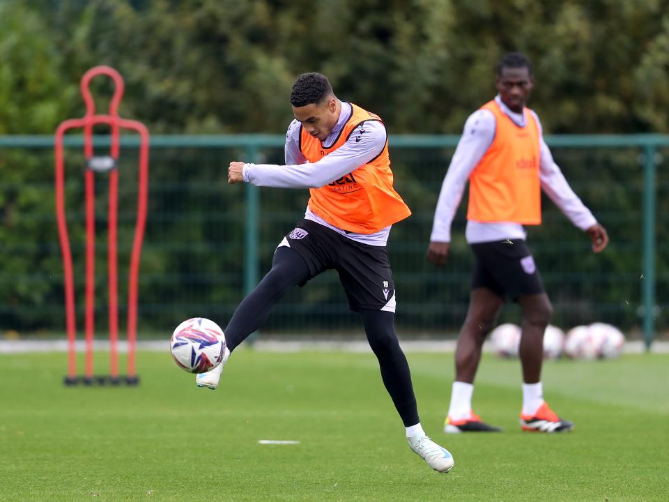 Lewis Dobbin firing at goal during a training session 