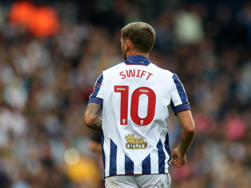 The back of John Swift's shirt with his name and No.10 on show