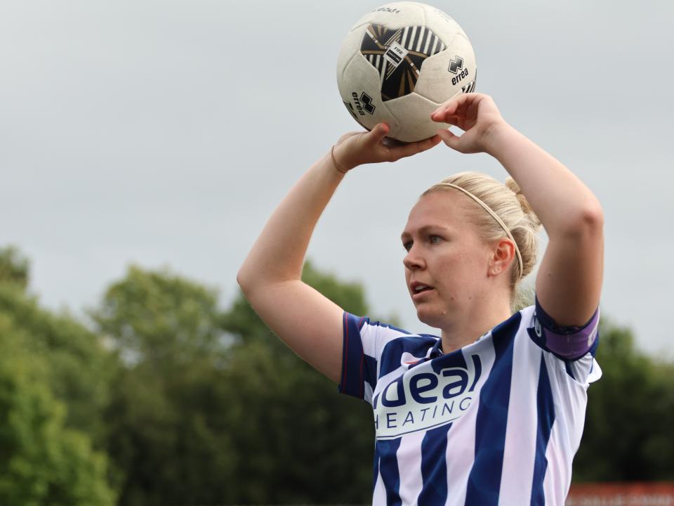 Hannah George takes a throw-in.