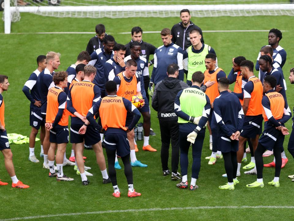 Carlos Corberán delivering instructions to his players on the pitch at The Hawthorns during a session 